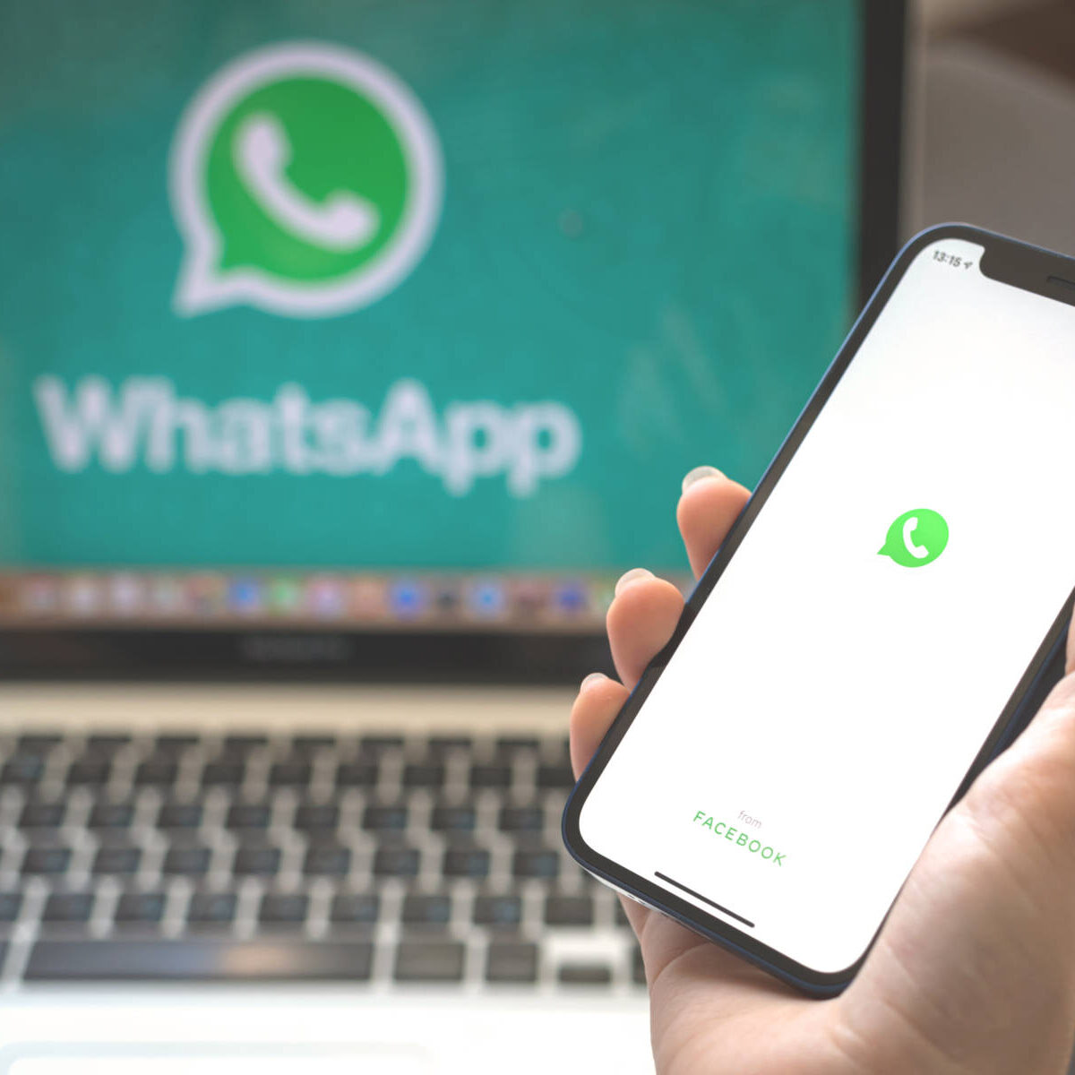 Kharkov, Ukraine - August 23, 2021: Whatsapp app logo on mobile phone screen. Woman using Whatsapp application photo