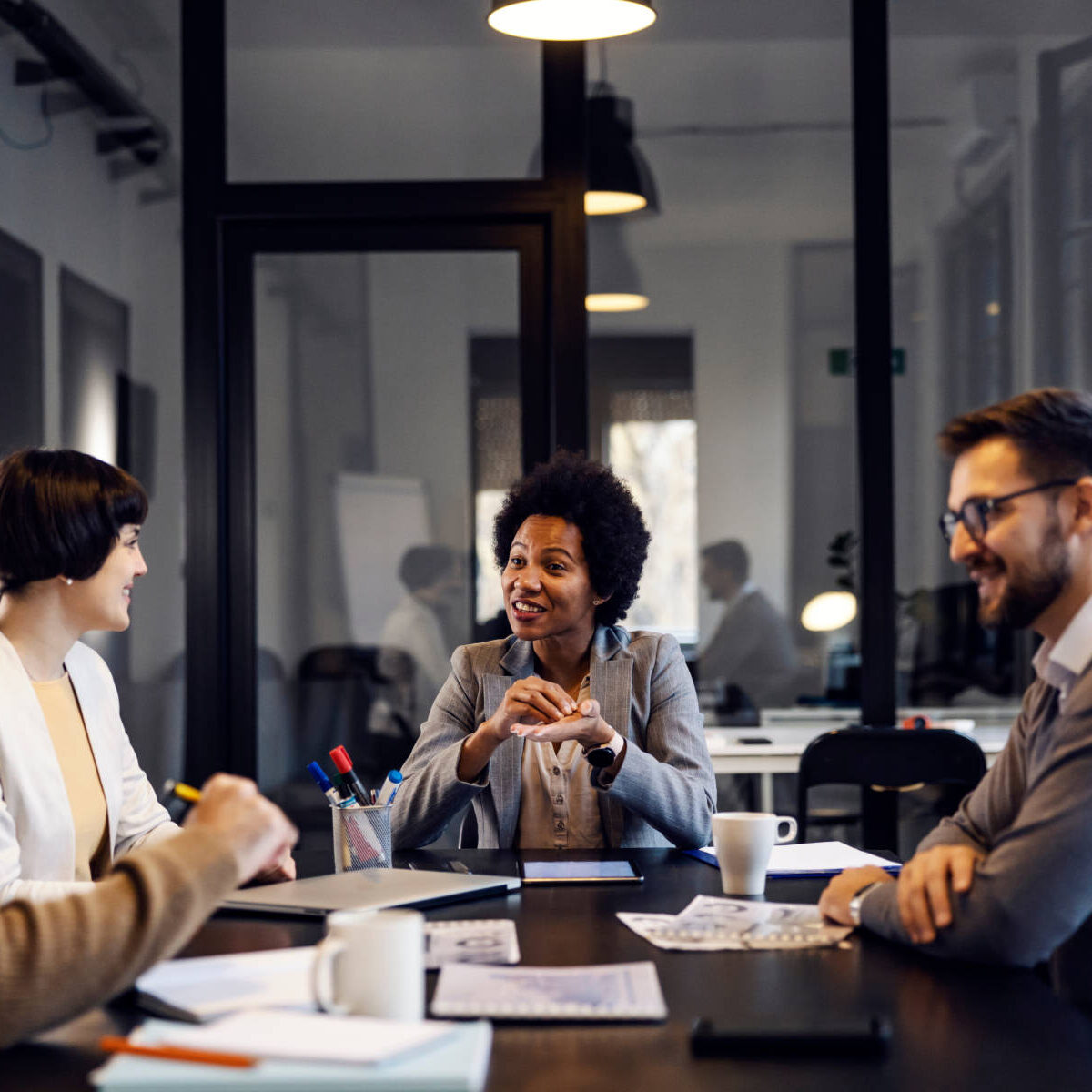 Group of multiracial businesspeople is having meeting in the office.