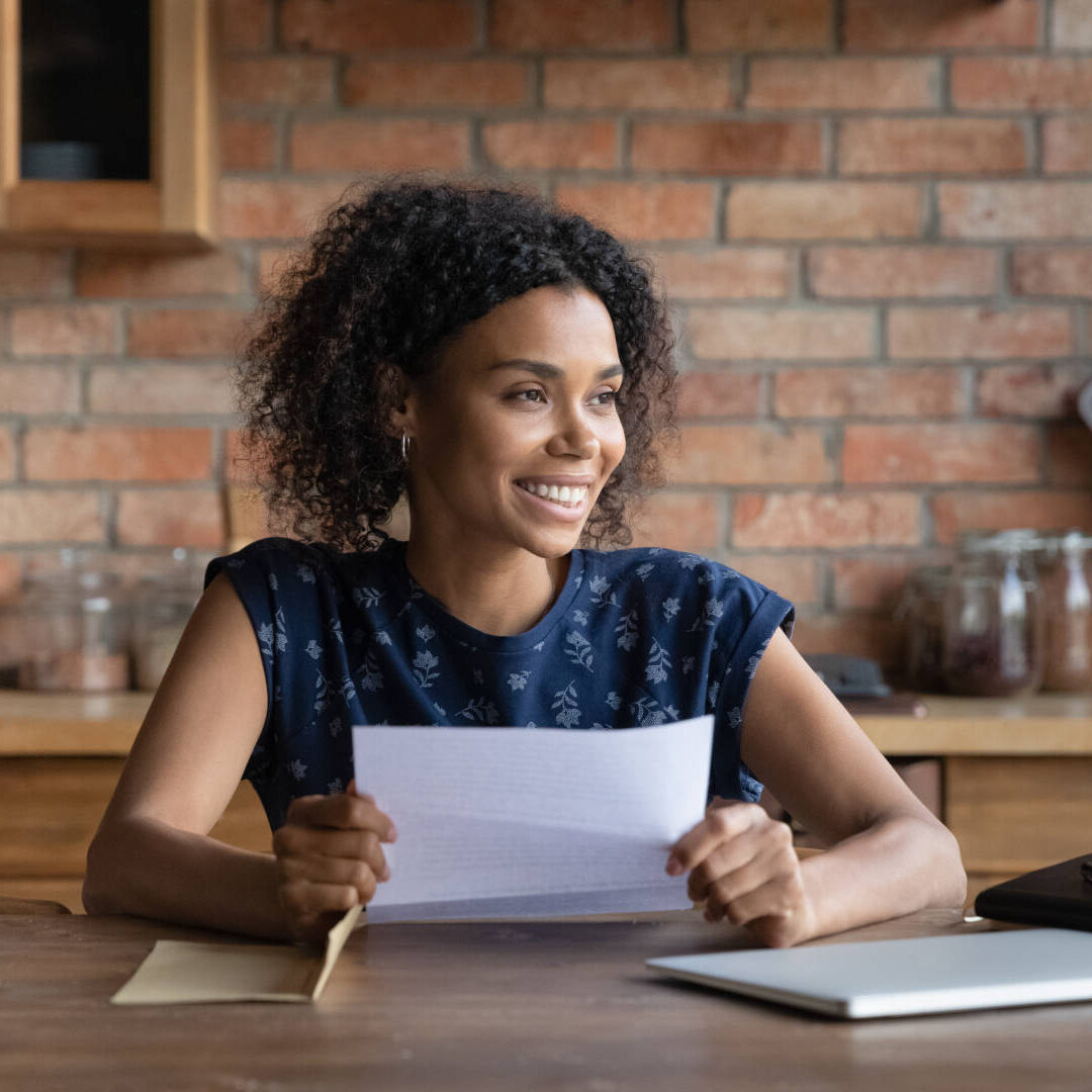 Ambitious young biracial woman get loan approval paper letter from bank dream of new opportunity. Happy black female small business owner receive good news by mail in financial report think of profit