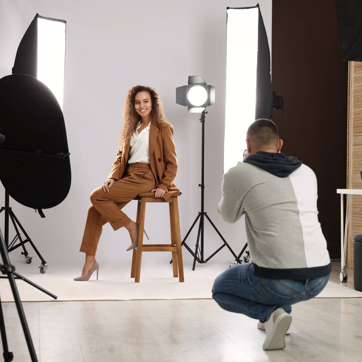 Beautiful African American model posing for professional photographer in studio